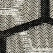 Herringbone woven textile with diagonal black bands over light gray and off-white checkerboard, dense fabric texture, grayscale palette.